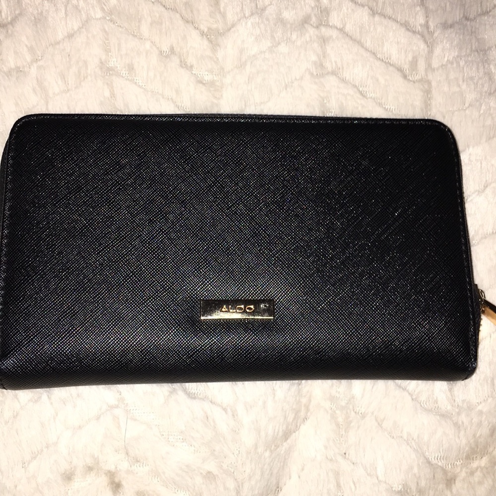 black wallet with gold hardware
